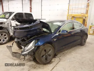 2018 Tesla Model 3 Long Range Battery with VIN 5YJ3E1EB7JF086201, listed as a IAAI auction lot 41965193 with 99,231 mi miles and . Bid and sale history available at DreamBid. Image 19.