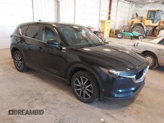 2018 Mazda CX-5 Touring with VIN JM3KFBCM9J0437490, listed as a IAAI auction lot 42006998 with 176,959 mi miles. Bid and sale history available at carsss.com. Image 1.