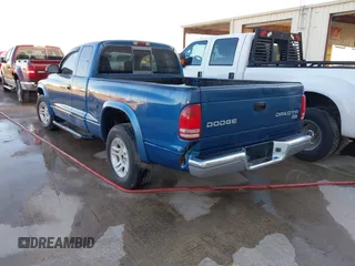 2003 Dodge Dakota SLT z VIN 1D7HL42N93S196397, wystawiony jako IAAI lot #42105857 z przebiegiem 159 690 mil mil oraz . Historia ofert i sprzedaży dostępna na DreamBid. Obrazek 3.
