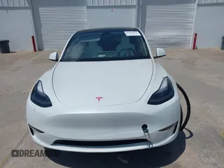 2023 Tesla Model Y Long Range with VIN 7SAYGDEE7PF865539, listed as a IAAI auction lot 42109673 with 34,923 mi miles and . Bid and sale history available at DreamBid. Image 12.