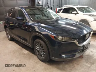 2020 Mazda CX-5 Touring with VIN JM3KFBCM5L0751284, listed as a IAAI auction lot 42157556 with 50,011 mi miles and . Bid and sale history available at DreamBid. Image 1.