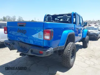 2022 Jeep Gladiator Texas Trail with VIN 1C6HJTAG4NL135346, listed as a IAAI auction lot 42824733 with 40,126 mi miles and . Bid and sale history available at DreamBid. Image 4.