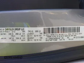 2014 Dodge Grand Caravan SXT with VIN 2C4RDGCGXER261467, listed as a IAAI auction lot 41801810 with 97,322 mi miles and . Bid and sale history available at DreamBid. Image 9.