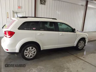 2019 Dodge Journey SE with VIN 3C4PDCBBXKT835029, listed as a IAAI auction lot 42120482 with 130,282 mi miles and . Bid and sale history available at DreamBid. Image 13.
