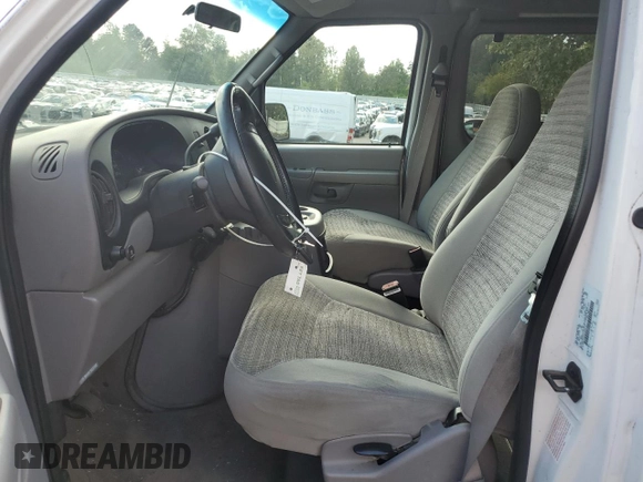 2002 Ford Econoline Passenger XL with VIN 1FMRE11WX2HA57114, listed as a Copart auction lot 68766174 with 167,382 mi miles and Salvage Title. Bid and sale history available at DreamBid. Image 7.