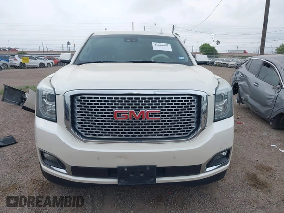 2015 GMC Yukon Denali z VIN 1GKS1CKJ3FR713531, wystawiony jako IAAI lot #41866691 z przebiegiem 157 666 mil mil oraz . Historia ofert i sprzedaży dostępna na DreamBid. Obrazek 13.