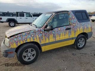 2003 Chevrolet Tracker z VIN 2CNBE18C136928311, wystawiony jako Copart lot #84463154 z przebiegiem 118 195 mil mil oraz Szkoda całkowita • Salvage title. Historia ofert i sprzedaży dostępna na DreamBid. Obrazek 1.