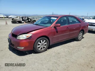 2003 Toyota Camry LE z VIN 4T1BF30K23U056007, wystawiony jako Copart lot #55187435 z przebiegiem 233 976 mil mil oraz Czysty tytuł • Clean title. Historia ofert i sprzedaży dostępna na DreamBid. Obrazek 1.