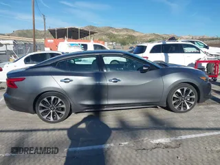 2018 Nissan Maxima Platinum z VIN 1N4AA6AP7JC392710, wystawiony jako IAAI lot #41866951 z przebiegiem 49 026 mil mil oraz . Historia ofert i sprzedaży dostępna na DreamBid. Obrazek 13.