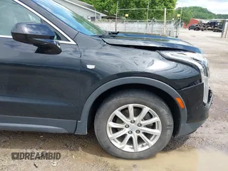 2019 Cadillac XT4 AWD Luxury z VIN 1GYFZBR41KF150209, wystawiony jako IAAI lot #42325529 z przebiegiem 76 828 mil mil oraz . Historia ofert i sprzedaży dostępna na DreamBid. Obrazek 17.