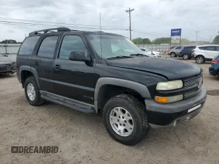 2003 Chevrolet Tahoe Z71 z VIN 1GNEK13Z13R301464, wystawiony jako Copart lot #53905395 z przebiegiem 165 360 mil mil oraz Szkoda całkowita • Salvage title. Historia ofert i sprzedaży dostępna na DreamBid. Obrazek 4.