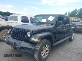 2023 Jeep Gladiator Sport S z VIN 1C6HJTAG3PL521954, wystawiony jako IAAI lot #42502126 z przebiegiem 49 606 mil mil oraz . Historia ofert i sprzedaży dostępna na DreamBid. Obrazek 14.