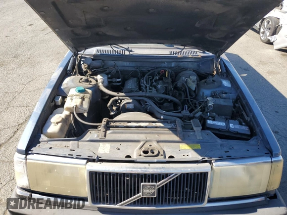 1993 Volvo 240 with VIN YV1AW8311P1955233, listed as a Copart auction lot 76514004 with 216,723 mi miles and Salvage title. Bid and sale history available at DreamBid. Image 11.