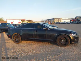 2018 Jaguar XJ with VIN SAJWJ2GD3J8W15092, listed as a IAAI auction lot 41844106 with 56,357 mi miles. Bid and sale history available at carsss.com. Image 13.