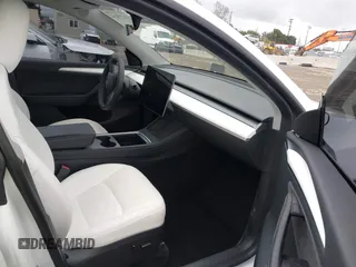 2023 Tesla Model Y Long Range with VIN 7SAYGDEE1PA106057, listed as a IAAI auction lot 41778642 with 1 mi miles. Bid and sale history available at carsss.com. Image 5.