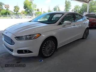 2016 Ford Fusion Titanium with VIN 3FA6P0K96GR390989, listed as a IAAI auction lot 42634275 with 123,559 mi miles and . Bid and sale history available at DreamBid. Image 2.