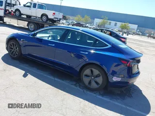 2019 Tesla Model 3 Mid Range with VIN 5YJ3E1EA0KF425079, listed as a IAAI auction lot 41871022 with 61,684 mi miles and . Bid and sale history available at DreamBid. Image 3.