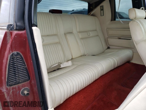 1986 Cadillac Eldorado z VIN 1G6EL5784GU616263, wystawiony jako Copart lot #48741325 z przebiegiem 59 213 mil mil oraz Tytuł czysty. Historia ofert i sprzedaży dostępna na DreamBid. Obrazek 10.