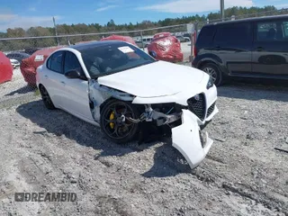 2021 Alfa Romeo Giulia Ti z VIN ZARFANBN5M7644349, wystawiony jako IAAI lot #41797100 z przebiegiem 30 938 mil mil oraz . Historia ofert i sprzedaży dostępna na DreamBid. Obrazek 1.