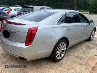 2013 Cadillac XTS Luxury z VIN 2G61P5S33D9171411, wystawiony jako Copart lot #59880945 z przebiegiem 268 029 mil mil oraz Czysty tytuł • Clean title. Historia ofert i sprzedaży dostępna na DreamBid. Obrazek 4.