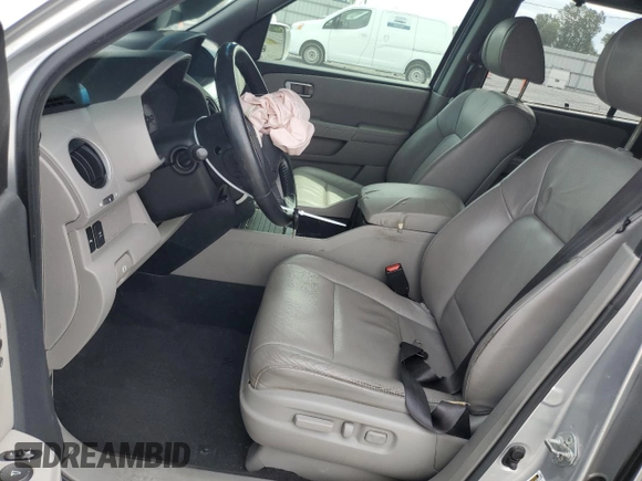 2010 Honda Pilot Touring with VIN 5FNYF3H82AB011212, listed as a Copart auction lot 71115874 with 248,495 mi miles and Salvage Title. Bid and sale history available at DreamBid. Image 7.