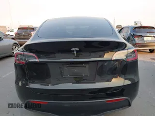 2025 Tesla Model Y Long Range with VIN 7SAYGDED5SF281818, listed as a IAAI auction lot 41302611 with 395 mi miles and . Bid and sale history available at DreamBid. Image 16.