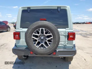 2024 Jeep Wrangler Sahara with VIN 1C4PJXEN6RW106911, listed as a Copart auction lot 58937945 with 13,948 mi miles and Salvage title. Bid and sale history available at DreamBid. Image 6.