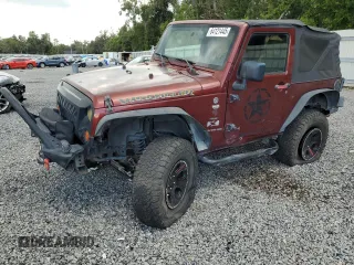 2007 Jeep Wrangler X with VIN 1J4FA24177L220311, listed as a Copart auction lot 64121445 with 129,893 mi miles and Salvage title. Bid and sale history available at DreamBid. Image 1.