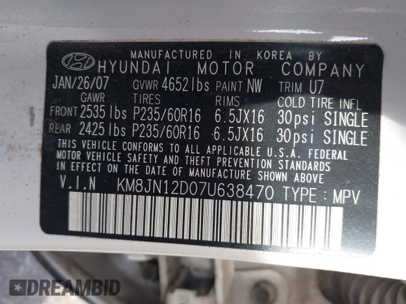 2007 Hyundai Tucson SE with VIN KM8JN12D07U638470, listed as a IAAI auction lot 41464634 with 203,283 mi miles. Bid and sale history available at carsss.com. Image 9.