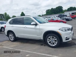 2014 BMW X5 sDrive35i z VIN 5UXKR2C54E0H34800, wystawiony jako IAAI lot #42110978 z przebiegiem 106 891 mil mil oraz . Historia ofert i sprzedaży dostępna na DreamBid. Obrazek 13.