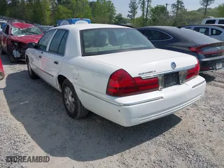 2003 Mercury Grand Marquis LS Premium with VIN 2MEFM75W33X669341, listed as a IAAI auction lot 42063018 with 124,047 mi miles. Bid and sale history available at carsss.com. Image 3.