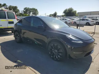 2023 Tesla Model Y Long Range z VIN 7SAYGAEE7PF859030, wystawiony jako Copart lot #58965185 z przebiegiem 18 421 mil mil oraz Czysty tytuł • Clean title. Historia ofert i sprzedaży dostępna na DreamBid. Obrazek 4.