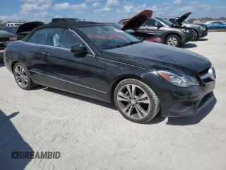 2015 Mercedes-Benz E 400 with VIN WDDKK6FFXFF301128, listed as a Copart auction lot 76691954 with 49,313 mi miles and Salvage title. Bid and sale history available at DreamBid. Image 4.