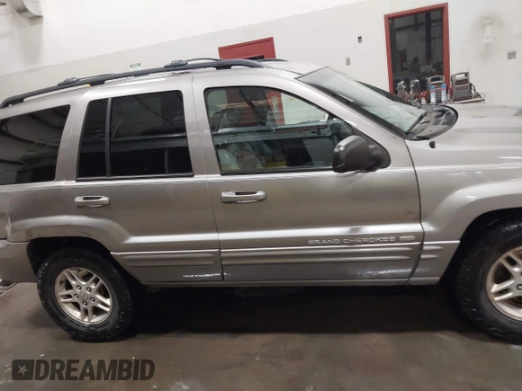 1999 Jeep Grand Cherokee Limited with VIN 1J4GW68N7XC752314, listed as a IAAI auction lot 41776905 with 228,023 mi miles. Bid and sale history available at carsss.com. Image 14.