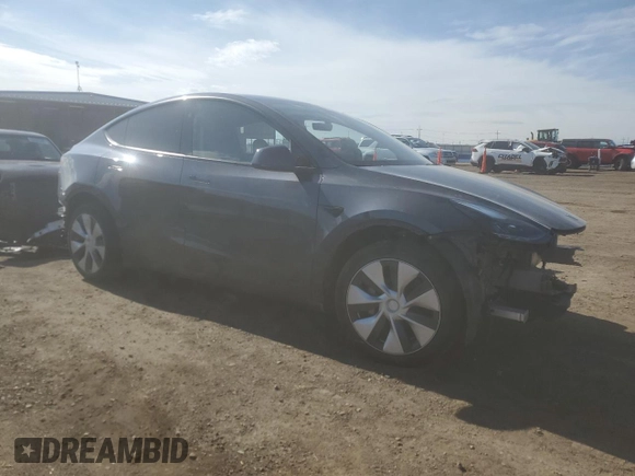 2023 Tesla Model Y Long Range z VIN 7SAYGDEE7PF965446, wystawiony jako Copart lot #54710375 z przebiegiem 23 807 mil mil oraz Szkoda całkowita • Salvage title. Historia ofert i sprzedaży dostępna na DreamBid. Obrazek 4.