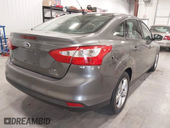 2013 Ford Focus SE with VIN 1FADP3F26DL359581, listed as a IAAI auction lot 42129909 with 129,832 mi miles. Bid and sale history available at carsss.com. Image 4.