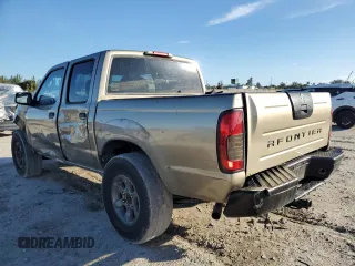 2004 Nissan Frontier XE with VIN 1N6ED27T34C400304, listed as a Copart auction lot 87015254 with 234,539 mi miles and Salvage title. Bid and sale history available at DreamBid. Image 2.