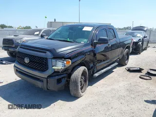2019 Toyota Tundra SR with VIN 5TFUY5F13KX852912, listed as a IAAI auction lot 42327399 with 124,193 mi miles and . Bid and sale history available at DreamBid. Image 17.