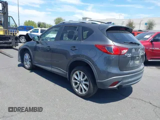 2014 Mazda CX-5 Grand Touring with VIN JM3KE4DY8E0391317, listed as a IAAI auction lot 41871641 with 77,048 mi miles. Bid and sale history available at carsss.com. Image 3.