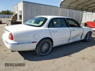 2005 Jaguar XJ with VIN SAJWA79C35SG48607, listed as a Copart auction lot 77132444 with 159,051 mi miles and Salvage Title. Bid and sale history available at carsss.com. Image 3.