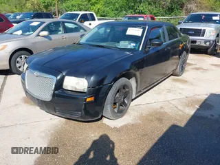 2005 Chrysler 300 with VIN 2C3JA43R65H668010, listed as a IAAI auction lot 41976405 with 216,099 mi miles. Bid and sale history available at carsss.com. Image 2.