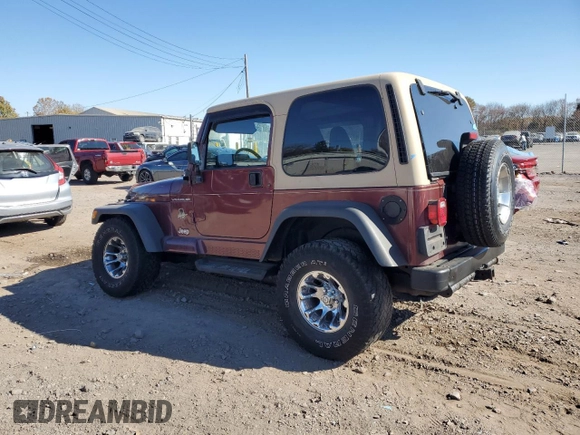 2002 Jeep Wrangler Sahara with VIN 1J4FA59S22P704603, listed as a Copart auction lot 77554334 with 99,758 mi miles and Salvage Title. Bid and sale history available at carsss.com. Image 2.