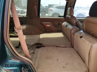 1995 Chevrolet Tahoe z VIN 1GNEC13K1SJ439759, wystawiony jako Copart lot #57784845 z przebiegiem 190 566 mil mil oraz Czysty tytuł • Clean title. Historia ofert i sprzedaży dostępna na DreamBid. Obrazek 10.