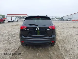 2014 Mazda CX-5 Touring with VIN JM3KE2CY7E0341658, listed as a IAAI auction lot 41915807 with 99,287 mi miles. Bid and sale history available at carsss.com. Image 17.