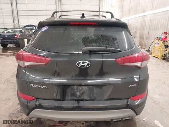2018 Hyundai Tucson Value with VIN KM8J3CA28JU648236, listed as a IAAI auction lot 41161221 with 104,057 mi miles. Bid and sale history available at carsss.com. Image 17.