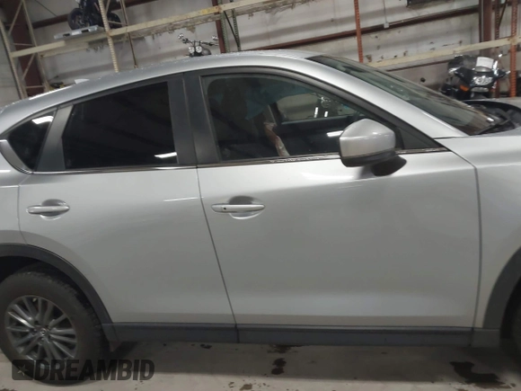 2020 Mazda CX-5 Touring with VIN JM3KFBCMXL0784653, listed as a IAAI auction lot 41817904 with 71,513 mi miles and . Bid and sale history available at carsss.com. Image 13.