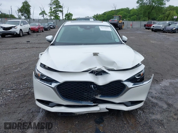 2021 Mazda 3 Preferred z VIN 3MZBPBCL0MM250862, wystawiony jako IAAI lot #42318612 z przebiegiem 86 056 mil mil oraz . Historia ofert i sprzedaży dostępna na DreamBid. Obrazek 12.