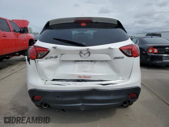 2016 Mazda CX-5 Touring with VIN JM3KE2CYXG0777715, listed as a Copart auction lot 52157005 with 58,585 mi miles and Salvage Title. Bid and sale history available at carsss.com. Image 6.