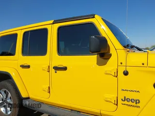 2018 Jeep Wrangler Unlimited Sahara z VIN 1C4HJXEN3JW306282, wystawiony jako IAAI lot #42302821 z przebiegiem 70 204 mil mil oraz . Historia ofert i sprzedaży dostępna na DreamBid. Obrazek 14.