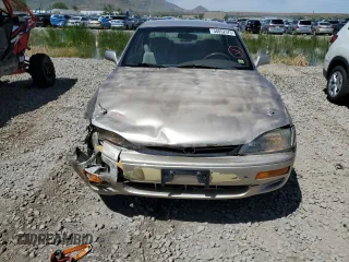 1996 Toyota Camry LE with VIN 4T1BF12K3TU132870, listed as a Copart auction lot 58052975 with 88,210 mi miles and Salvage title. Bid and sale history available at DreamBid. Image 5.